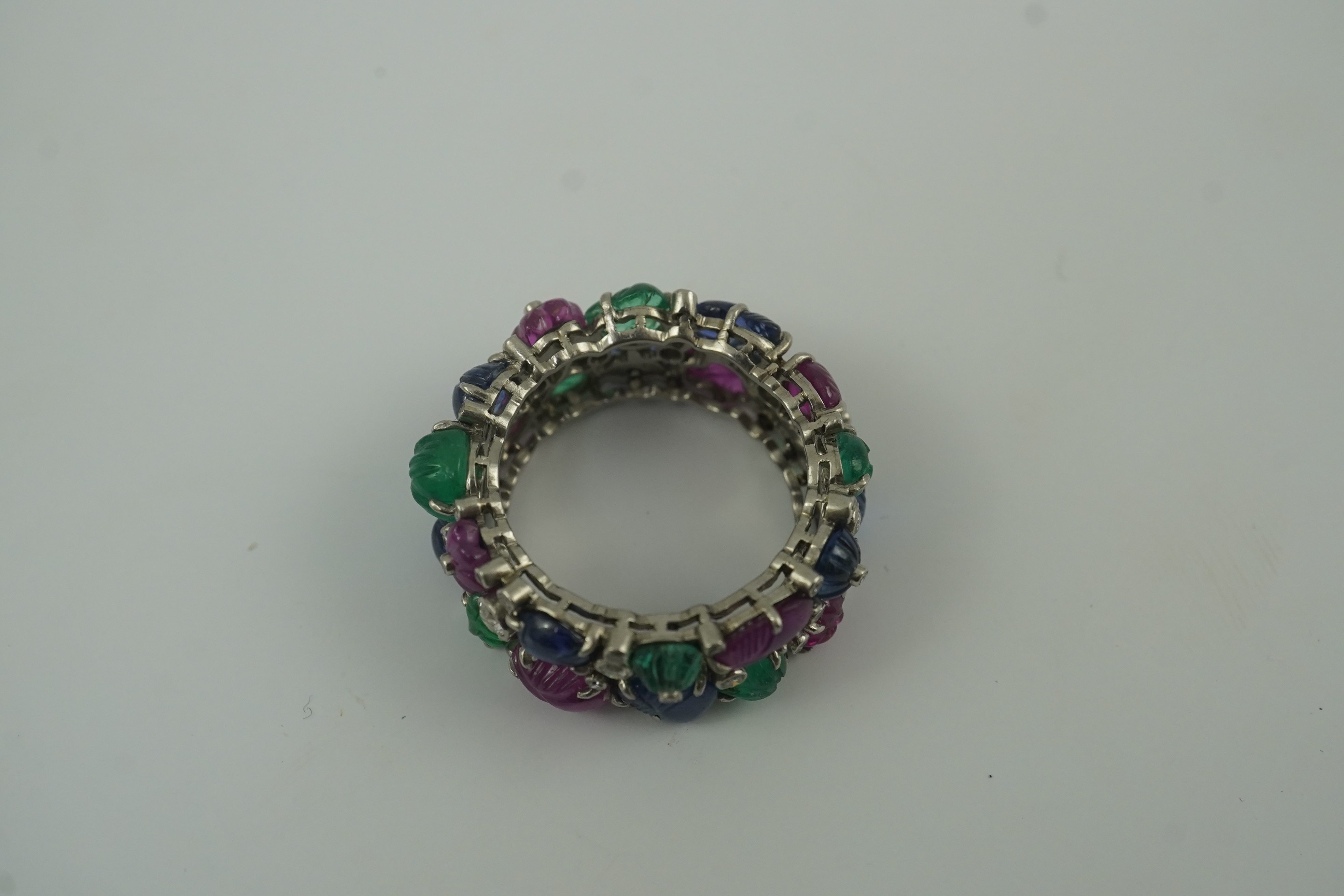 A Mauboussin style platinum, ruby, emerald, sapphire and diamond set 'Tutti Frutti' ring